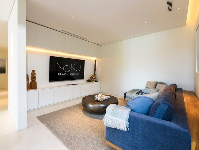 022 Noku Beach House - Wide TV screen and comfortable couch