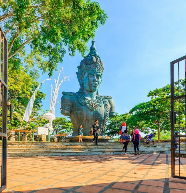 ULUWATU, BALI, INDONESIA - MARCH 26 : Tourist visit Lord Vishnu statue at the Garuda Wisnu Kencana Cultural Park on March 26, 2014 in Uluwatu, Bali, Indonesia.